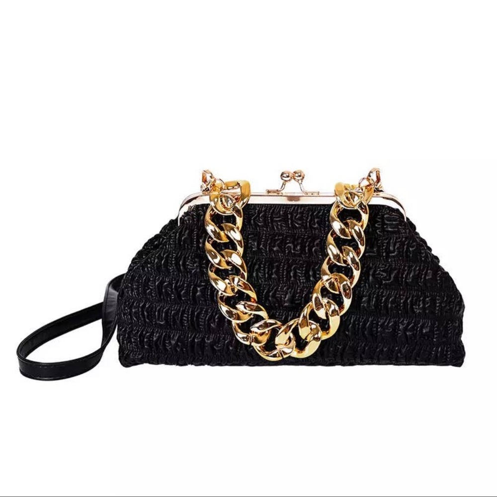 Large size women's handbag with gold chunky chain handle.